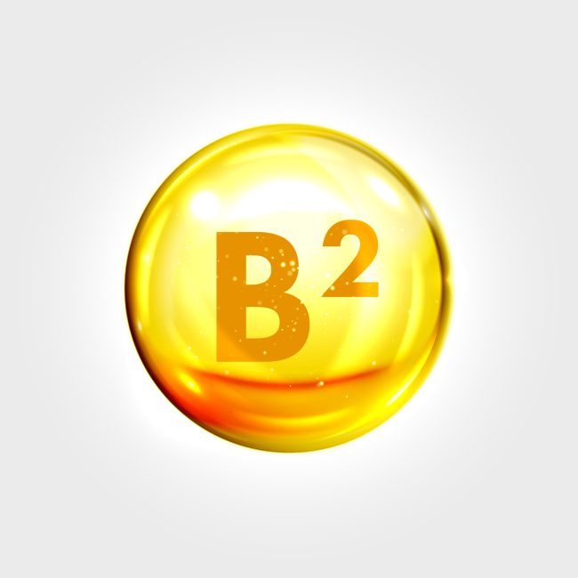 Vitamin B2 gold icon. Riboflavin pill apsule